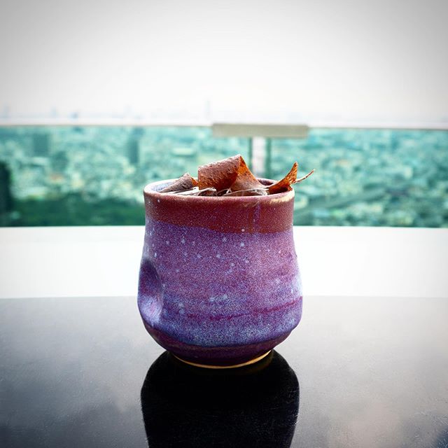 Cocktail with city in background
