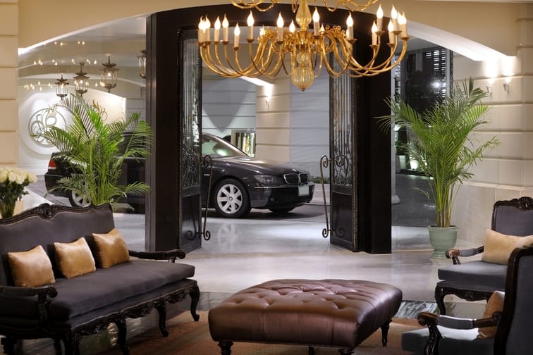 Hotel lobby couch and car in the back